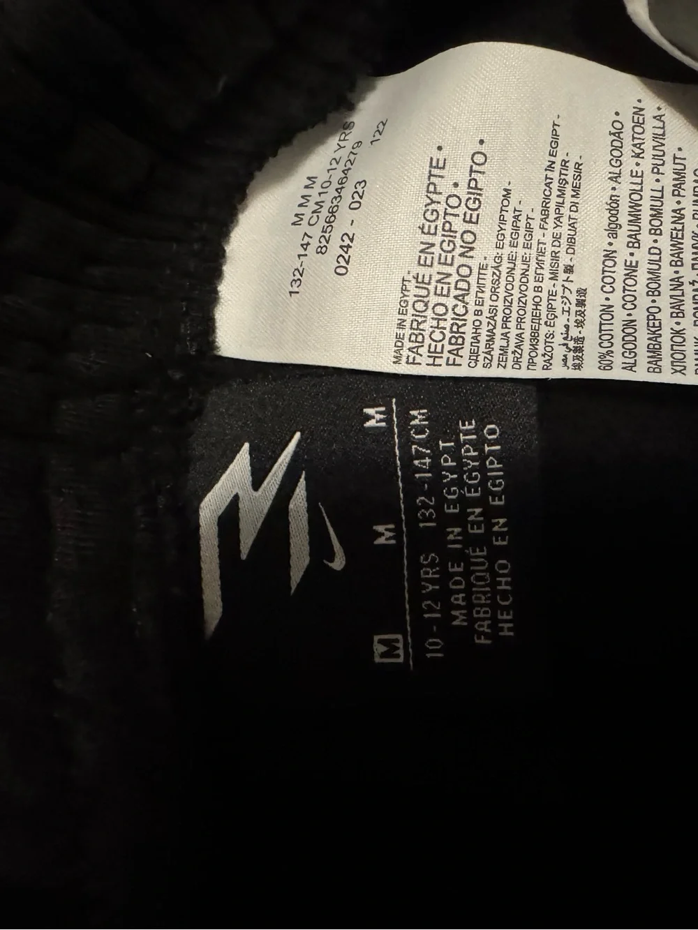 Nike Black Shorts with White Graphic Swoosh